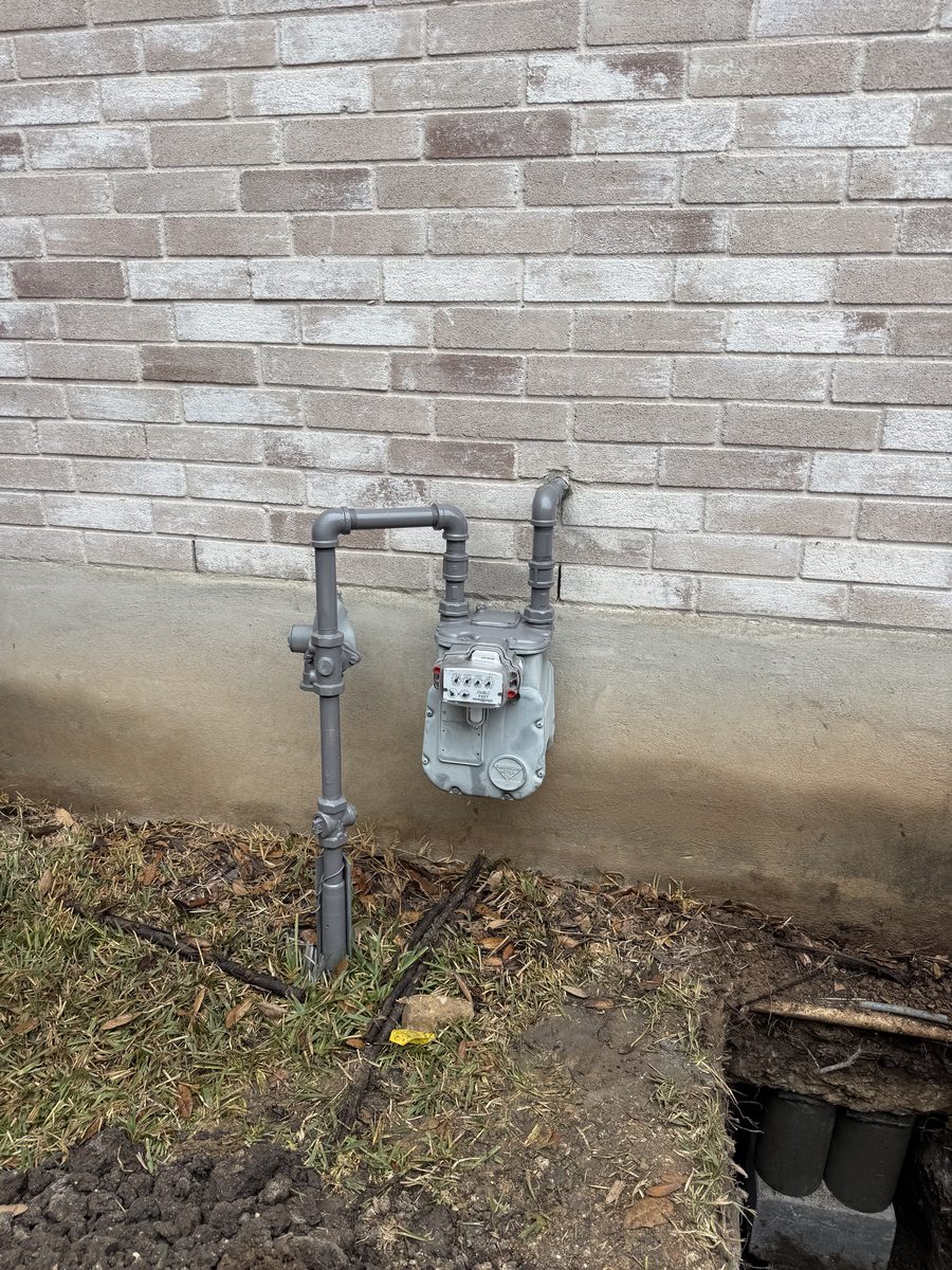Finished gas meter repair with the piping painted gray
