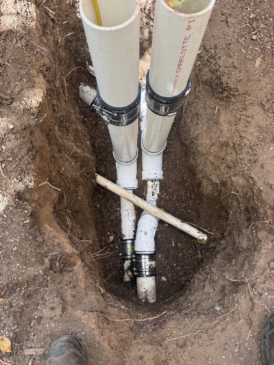 New sewer cleanout risers installed in an open trench